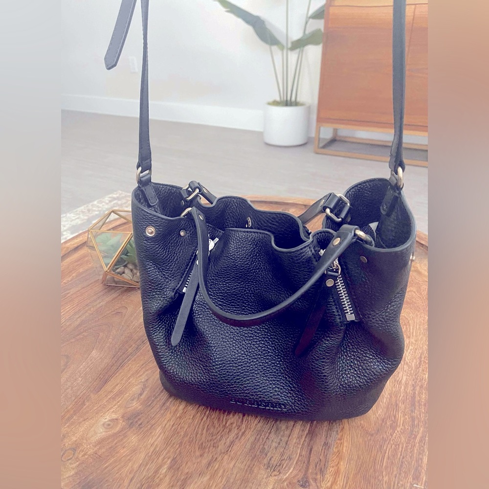 Burberry Crossbody purse, black leather with pattern on each end.  Med size bag